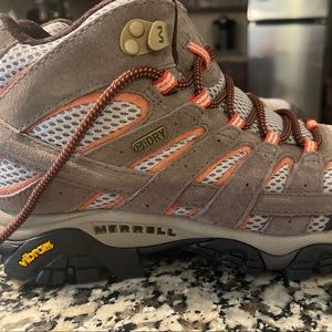 Merrell Vibram Hiking Boots. Worn once. Size 8 US, tan with orange accent.